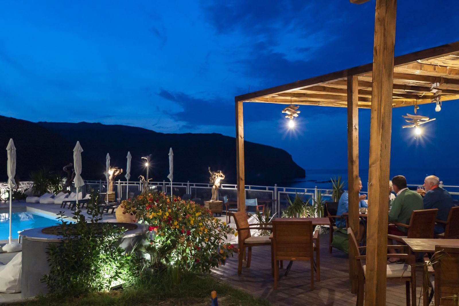 The pergola by the pool in the evening